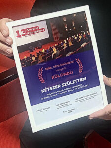különdíj